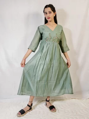 Front view of Mul Chanderi Green Kurti with the flared hem held out to show its flowing silhouette