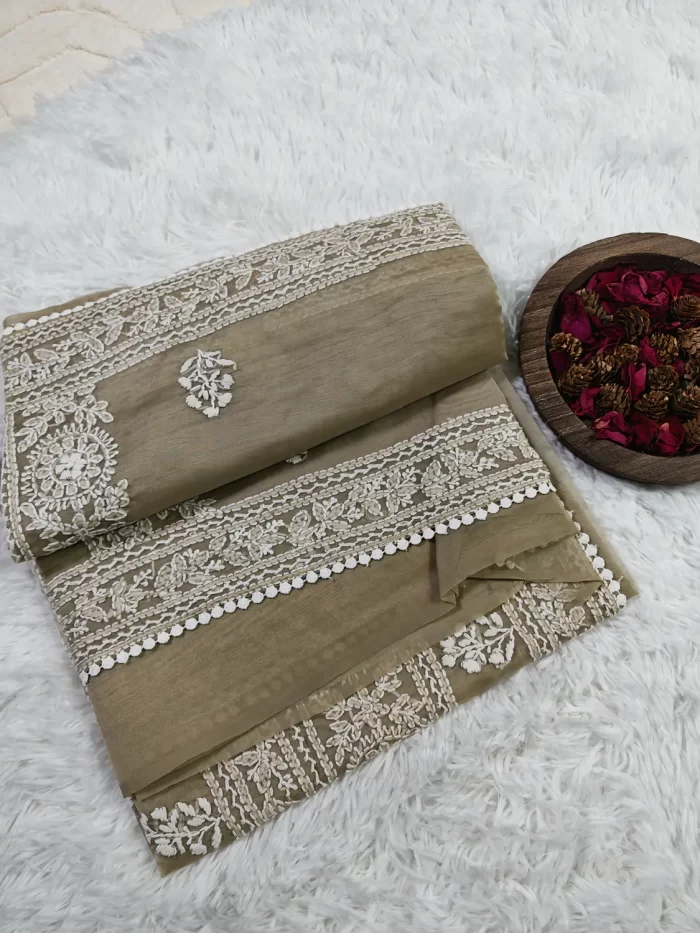 Angled folded view of Smokey Taupe Crushed Organza Saree with white Chikankari panels