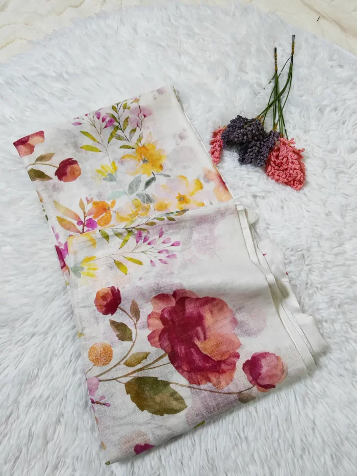 Printed Linen Saree (1)_lr Folded Printed Linen Saree with soft multicoloured botanical print on a white background