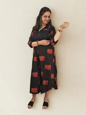 Full-length pose in the black boho elephant print shirt dress