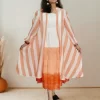 Front view of Sorbet striped shrug dress with layered hem
