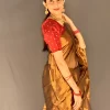 Angled view of Golden Radiance saree with red blouse