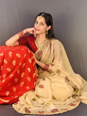 Elegant beige chiffon saree with dark red blouse piece included