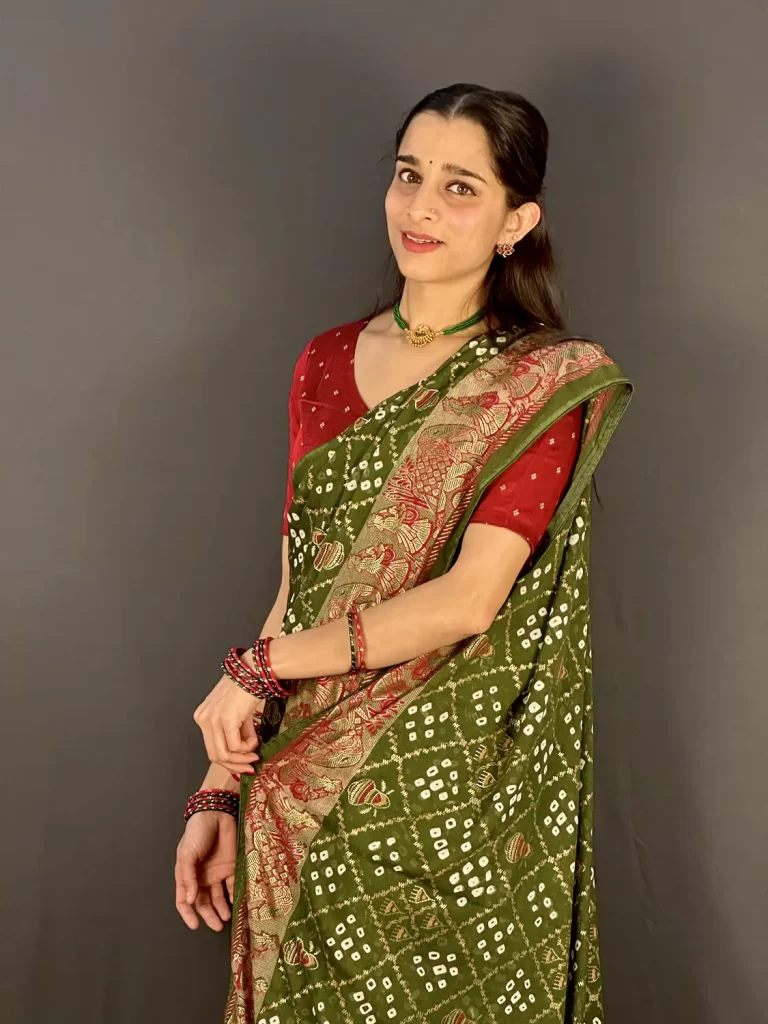Women's forest green traditional saree with Bandhini print and elegant drape