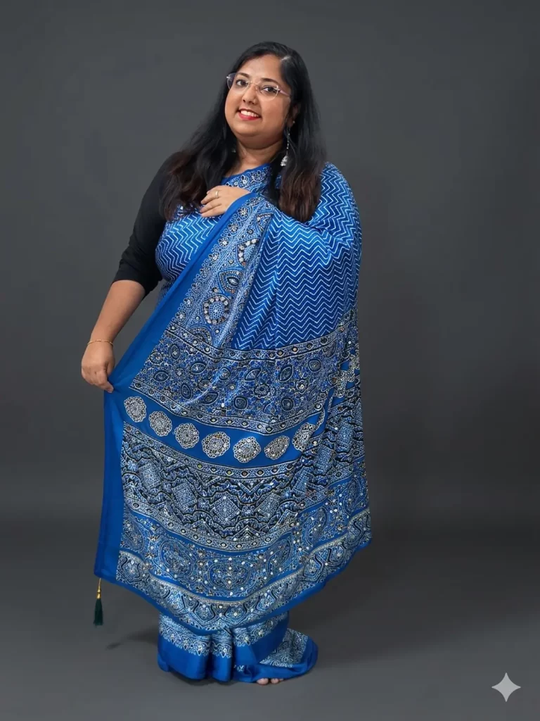 Royal blue zigzag Ajrakh printed saree with mirror-work border, three-quarter view
