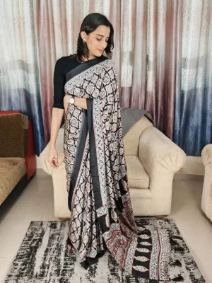 Ajrakh black mirror-work saree with patterned pallu, full-length front view