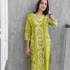Lime green Ikat printed co-ord set shown in a close portrait view