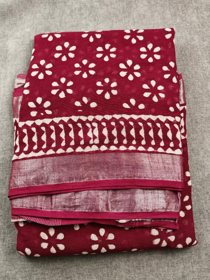 Maroon ethnic saree with handcrafted-inspired patterns