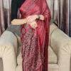 Woman wearing Maroon Modal Satin Silk Saree with decorative border