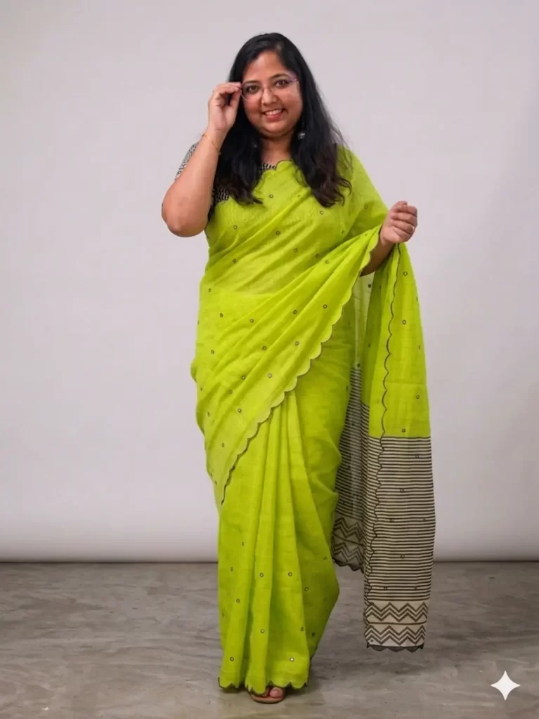 Pista green linen cotton mirror saree with scalloped border and striped pallu, front view