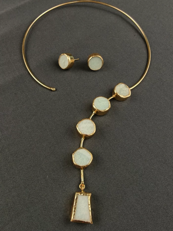 ASYMMETRIC STONE CASCADE NECK CUFF SET Asymmetric Stone Cascade Neck Cuff Set with pale raw-look stones and matching studs