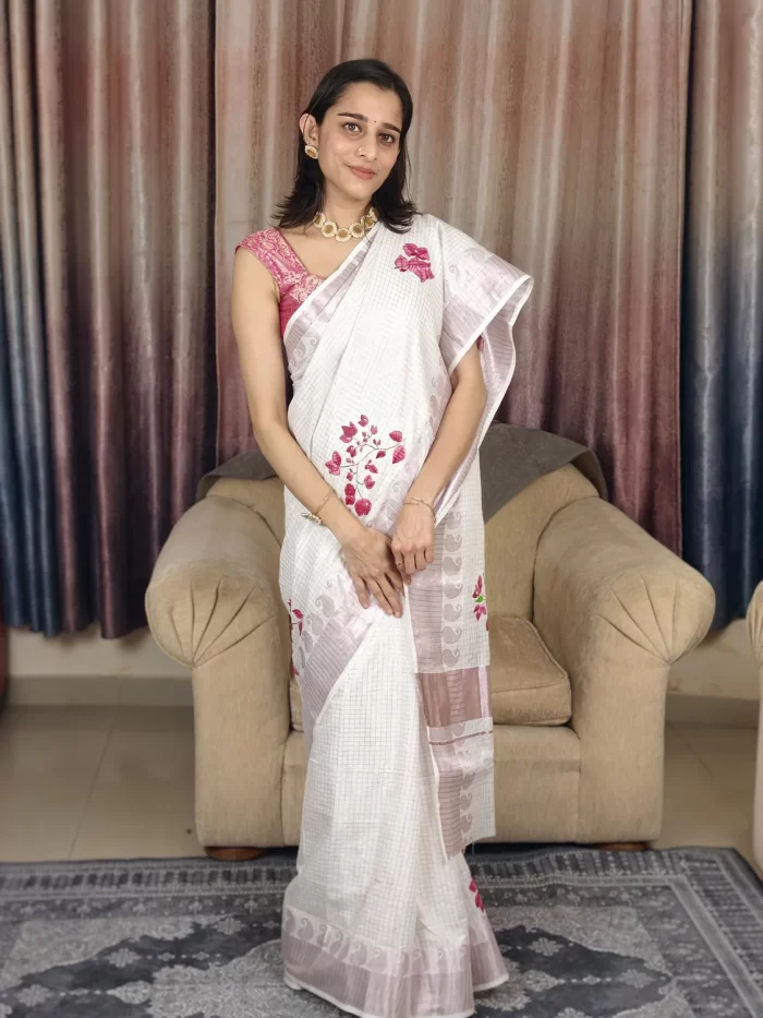 Bougainvillea Hand Painted Saree Straight-on view of Bougainvillea Hand-Painted Saree with pink flowers along the drape and hem