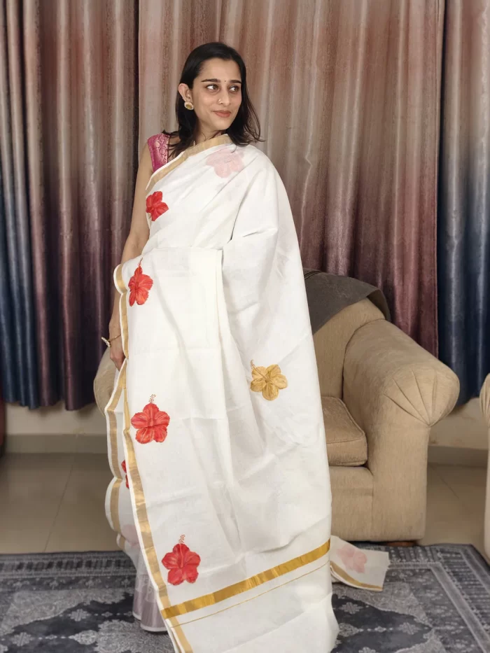Chembarathi Hand Painted Saree (3) Chembarathi Hand-Painted Saree in a three-quarter pose with golden border