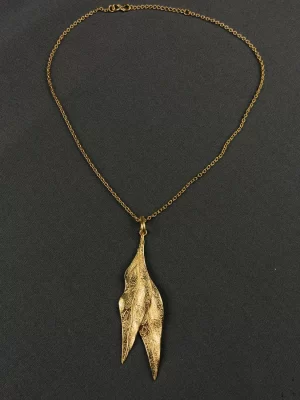 Dual Leaf Neck Chain with an elongated textured gold-toned leaf pendant