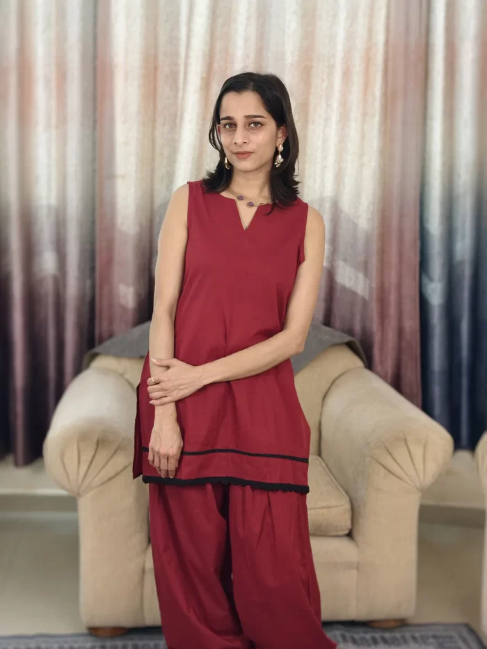 Deep Red Farshi Salwar Set (3) Front three-quarter view of Deep Red Farshi Salwar Set highlighting the layered tunic hem