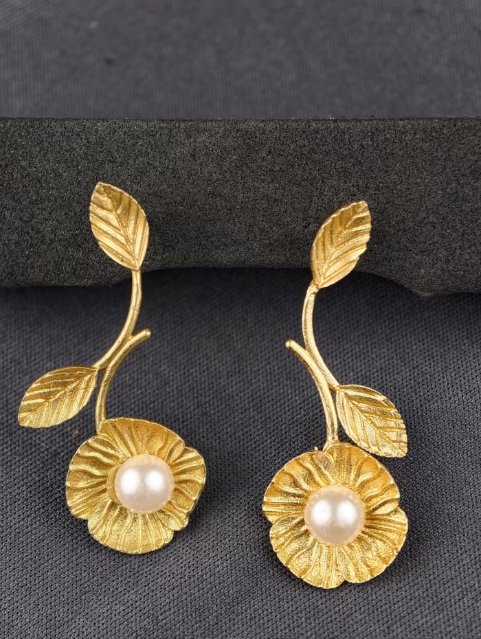 FLORA VINE DROPS EARRINGS Flora Vine Drop Earrings with textured floral discs, pearl-like centres and leafy stems