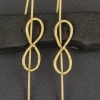 Infinity Loop Ear Cuffs with elongated textured gold-toned loops