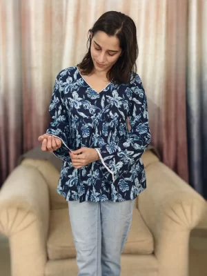 Indigo Floral Print Peplum Top close-up highlighting the flared sleeve and lace trim