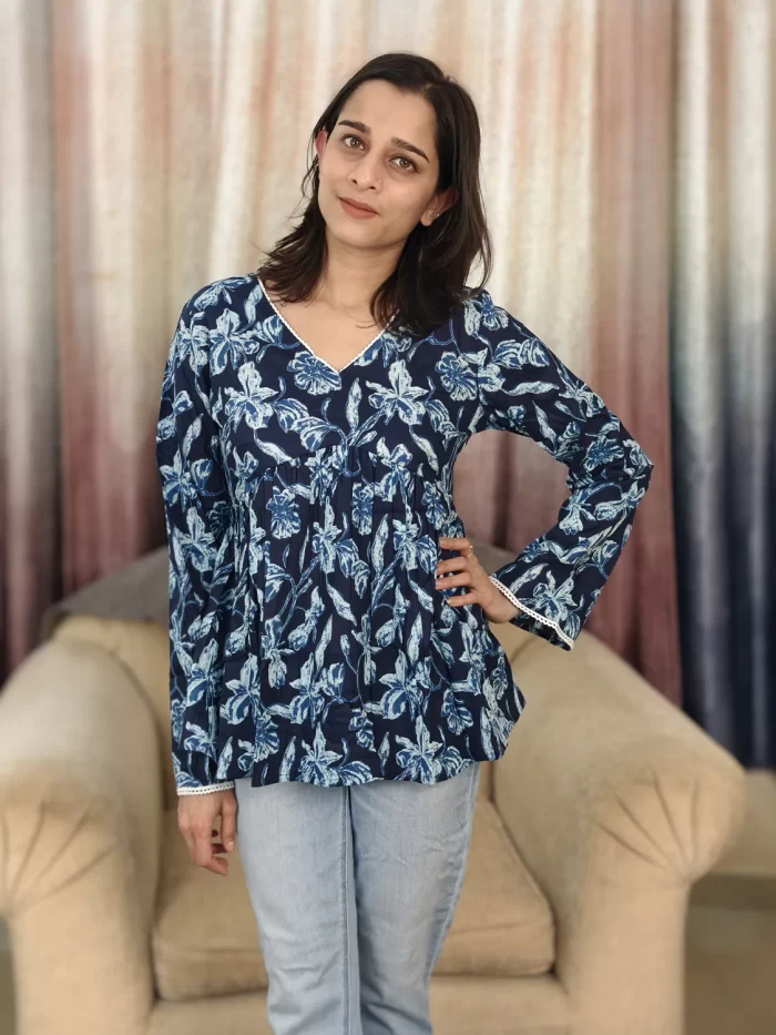 Indigo Floral Print Peplum Top (8) Indigo Floral Print Peplum Top front view with hand on hip