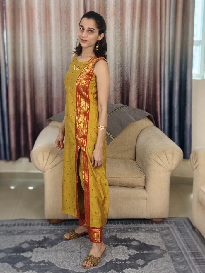Mustard Yellow Zari Bordered Cotton Silk Coordset (6) Mustard Yellow Zari Bordered Co-Ord Set side view highlighting the red border