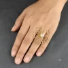 Open Petal Pearl Ring worn on the hand