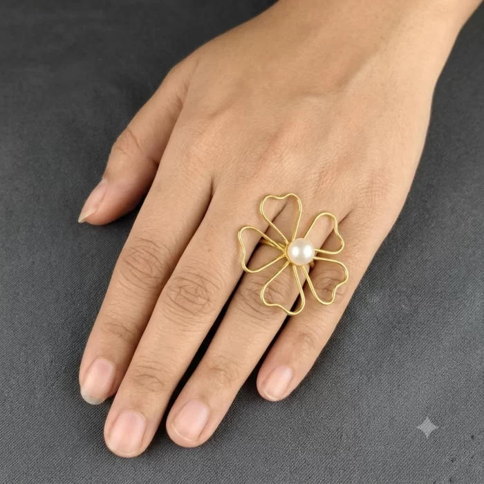Open Petal Pearl Ring worn on the hand