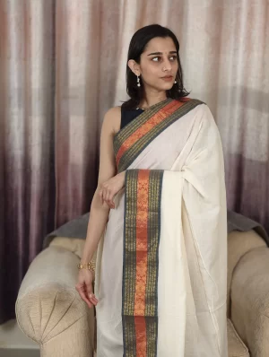 Offwhite Mulcotton Saree with Black & Orange Border (1) Off-White Mul Cotton Saree with Black & Orange Border upper-body front view