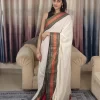 Offwhite Mulcotton Saree with Black & Orange Border (5) Full-length front view of Off-White Mul Cotton Saree with black and orange woven border