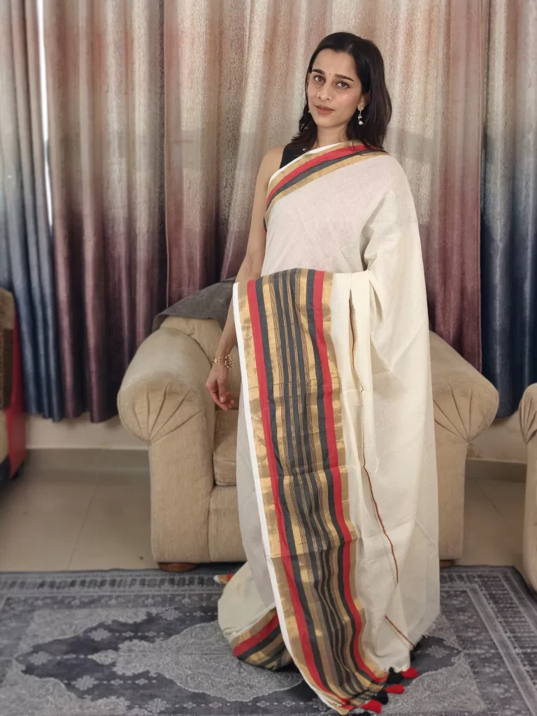 Off-White Mul Cotton Saree with Red, Black & Golden Border in a full-length front view