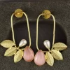 Pink Pearl and Leaf Frame Statement Earrings with teardrop stones and gold-toned leaves