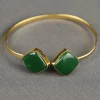 ROYAL HORIZON OPEN BANGLE - GREEN Green Royal Horizon Open Bangle with faceted square stones