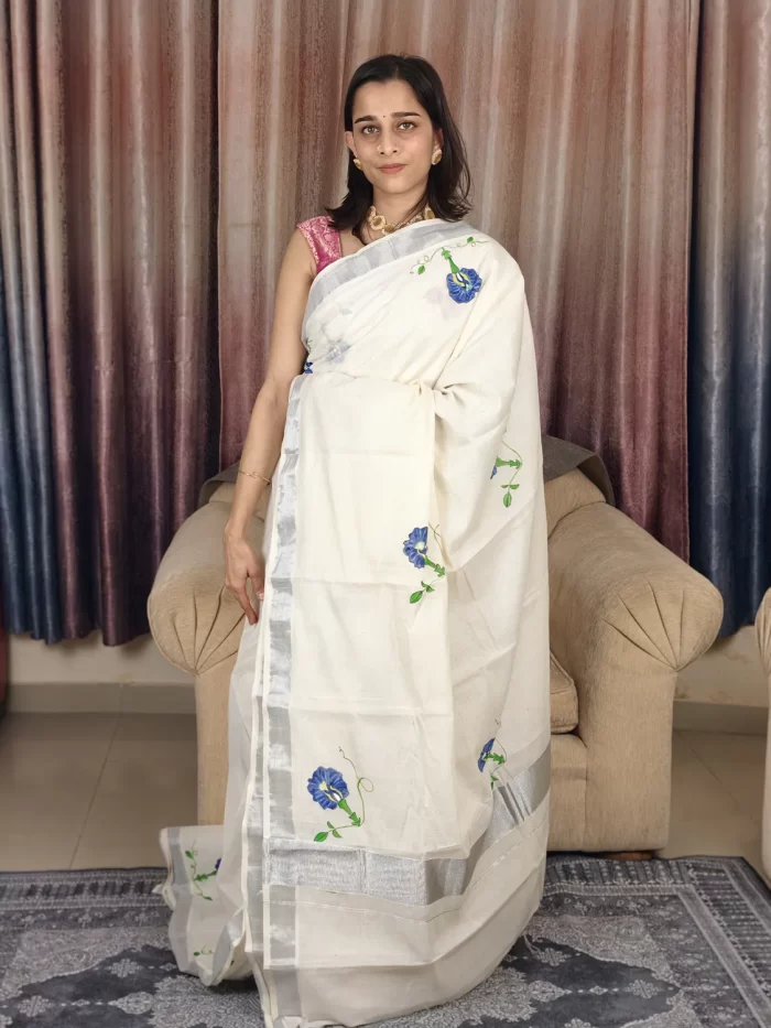 Shangupushpam Hand Painted Saree (2) Shangupushpam Hand-Painted Saree in a full-length front view with silver-toned border