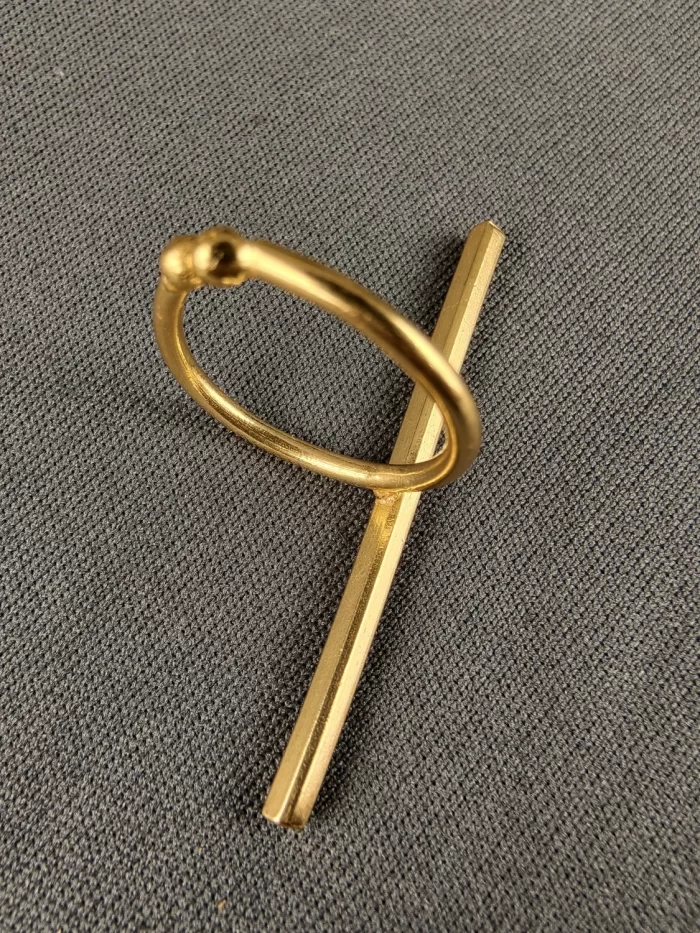 VERTCAL BAR STATEMENT RING Vertical Bar Statement Ring with a long gold-toned bar on an open band