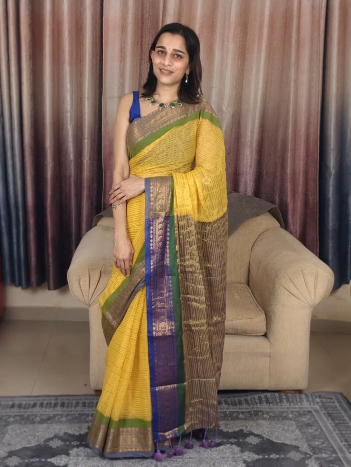Yellow Mul Cotton Saree with Green & Blue Border (2) Yellow Mul Cotton Saree with Green & Blue Border in a full-length front view