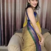 Yellow Mul Cotton Saree with Green & Blue Border (5) Yellow Mul Cotton Saree with Green & Blue Border in a side-facing close-up
