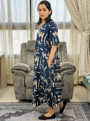 Navy and ivory abstract print maxi dress, side view showing pocket and fit