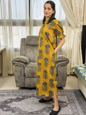 Mustard and teal printed maxi dress, side view showing pocket and slit