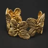sculpted-butterfly-open-cuff-bangle-1.webp Gold-tone butterfly-inspired open cuff bangle